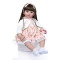 Lifelike reborn toddler girl doll with long brown hair in a pink floral lace dress - White / 60 cm