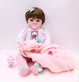 Realistic reborn baby doll with pink pig-themed outfit, plush blanket and sippy cup - Blue Eye / Pink
