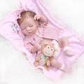 Bambola realistica in silicone con cardigan rosa a righe e scimmietta di peluche marrone - Figura 2 / 49cm
