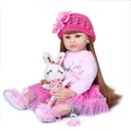 Realistic reborn toddler doll with long brown hair, pink tutu outfit and plush bunny accessory - Pink Flower Hat Set