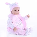 Muñeca Reborn realista con traje de conejo rosa y textura de piel de silicona suave - Rosa