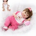Lifelike reborn baby doll in pink romper with teddy bear bib and feeding accessories - 47cm (Full Body Vinyl) / Blue