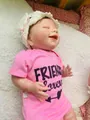 Lifelike reborn doll twin in pink romper with white knit hat on floral bedding - 55 cm / Closed Eyes Style / Pink
