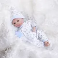 30cm lifelike reborn baby doll in blue printed romper resting on white plush background - Open Eyes (Blue) / Blue