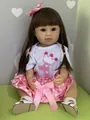 Detailed view of a 55cm realistic reborn toddler doll in a pink polka dot tutu skirt - Blue Eye / Crown T-shirt with Polka Dot Skirt (Style 2)