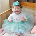 Reborn baby doll with brown curls in blue tutu skirt and lion print bodysuit - Cartoon Lion Print (4623890615953) / Blue Gold