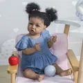 Reborn African American baby girl doll with dark skin and blue eyes in denim dress - Dark Brown Skin with Clover Necklace (Style 1)