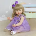 Lifelike 55cm silicone doll with blonde hair in a purple mesh dress and bow headband - 55cm / Brown Eyes Style / Gold Hair