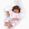Close-up of lifelike 47cm reborn baby girl doll with pink bow and feeding bottle - Brown Eye / Brown Skin