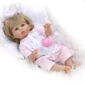 Detailed view of reborn baby doll in pink cherry outfit with a toy feeding bottle - Brown Eye / White Skin