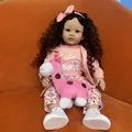Lifelike 60cm reborn toddler doll with curly brown hair, pink hoodie and giraffe toy - 60cm Blue Eyes / Pink Fox Outfit (1)