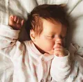 18-inch sleeping Reborn Baby Twina doll with hand-rooted brown hair and heart romper - Cloth Body (Soft Cotton Body) / White And Pink Heart Pattern Long Sleeve Outfit