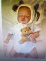 Realistic sleeping Rosalie baby doll with yellow knit hat and brown plush teddy bear - Sleeping Doll With Hat And Bear