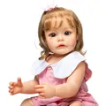 Close-up of lifelike baby doll featuring detailed facial expressions and pink bow - 55 cm / Pink Princess Dress