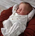 Close-up of lifelike 19 inch reborn baby doll Levi sleeping in printed romper - Exquisite Painting (Style 2) / Cloth Body