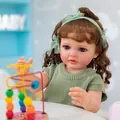Macro close-up of realistic reborn baby doll Betty with brown hair and green headband - Green Knit Mesh Dress Style (As Shown) / 3D Exquisite Painted