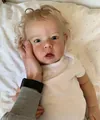 75cm Liam reborn baby doll with blonde hair in white bodysuit on polka dot bedding - White / 50 cm
