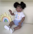 Detailed close-up of a 60cm reborn doll with dark skin and curly hair in a birthday outfit - Afro Double Ponytail 1st Birthday Dress Style (2014 Black) / 60 cm