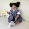 Close-up of 60cm lifelike reborn baby doll Mila with curly black pigtails and floral dress - African American Baby Girl Realistic Doll / 60cm Cloth Body Style