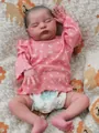 Detailed view of 20-inch reborn doll Laura with realistic 3D skin texture and veins - Pink Floral Style / 50 cm