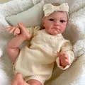 20 inch lifelike reborn baby doll with visible veins and cream knit outfit on soft rug - Beige Knit with Lace Bow Style / 50cm
