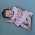 19-inch realistic sleeping Ashia reborn doll in pink polka dot dress on blue fabric - Pink Polka Dot Dress Sleeping Baby Style / 19-inch