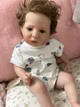 Detailed view of 60cm lifelike reborn baby doll with realistic skin texture and blue outfit - Realistic Flesh Tone (As Pictured) / 60 cm