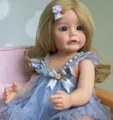 Reborn baby doll with blonde hair, blue eyes and blue tulle dress on a pink chair - Blonde Hair Blue Eyes Tulle Dress / Light Blue