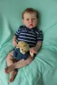 Close-up of 75cm realistic Liam reborn doll with 3D skin texture and blue striped polo shirt - 50cm / Baby Blue Striped (Liam)