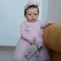 Realistic 60cm reborn toddler doll Sandie in pink knit dress with plush bear toy - Pink / 60 cm