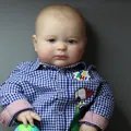 Lifelike 60cm Joseph reborn baby doll wearing a blue plaid shirt and cartoon patch - Open Eyes Blue Gingham Shirt Style / 60CM
