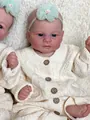 Elijah lifelike 46cm newborn reborn baby doll wearing a cream knit cardigan with green flower - Bald Style (2167) / 46cm