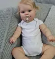 50cm lifelike reborn baby girl doll Maddie in white bodysuit with pink pacifier - Cloth Body Style 2