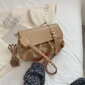 Chic beige ruched crossbody bag with woven handle and flap buckle detail - Khaki
