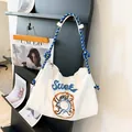 Sac hobo en toile blanche avec imprimé donut et anse en corde tressée bleue - Bleu