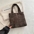 Dark coffee brown tote bag in woven texture with gold button and large capacity - Brown