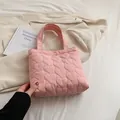 Pink heart-quilted large capacity tote bag with puffy nylon finish and gold clasp - Pink