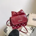 Chic red mini crossbody bag with a large bow and white polka dots on matte leather - Red