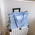 Light blue tote bag with transparent window, ribbon weave details and long straps - Blue