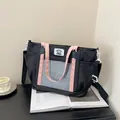 Black and pink ita tote bag with large transparent PVC display pocket and star details - Black