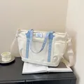 Creamy white large crossbody tote bag with clear PVC pocket and blue straps - Off White