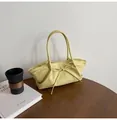 Pale yellow woven handbag for women with bow decoration and crescent shape design - Yellow