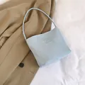 Light blue faux leather shoulder bucket bag with Pretty and Libety embossed lettering - Blue