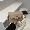 Vintage light brown leather saddle bag for women with golden horseshoe buckle and strap - Khaki