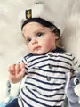 Close-up of lifelike reborn baby boy doll in navy sailor outfit with realistic skin details - Navy Style Boy Version / 60 cm