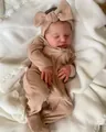 Detail of 20 inch reborn baby doll with 3D skin texture in khaki ribbed sleepsuit - 48cm / Cloth Body Style / Light Coffee