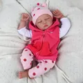 55cm lifelike reborn baby doll in pink polka dot outfit sleeping on a soft white knit blanket - 55 cm / Pink White