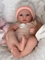 Close-up of Meadow reborn baby doll with realistic 3D skin texture and pink baby outfit - Full Silicone Body