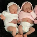 Realistic 48cm newborn reborn dolls in white and pink knit hoodies sleeping on black rug - 48cm / White