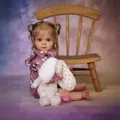 Lifelike toddler doll with pigtails wearing a floral purple dress holding a plush bunny - Purple Floral Dress Style / 60cm Cloth Body